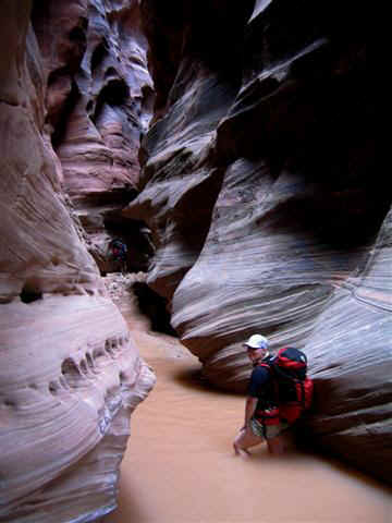 Shauna wades through Buckskin Gulch.