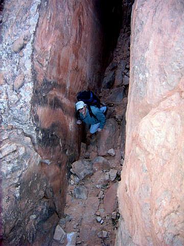 Climb up the approach slot.