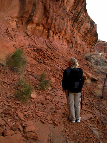 Shauna hiking the ledge below the panel.