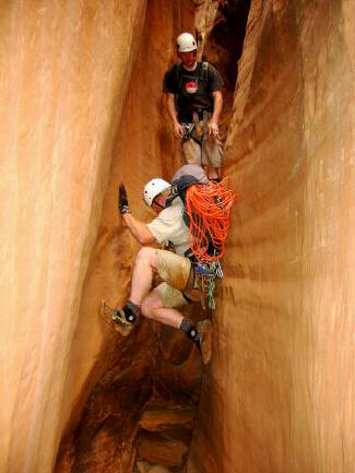 Scott Card Downclimbs while Sam Gregory watches.