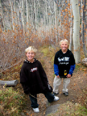 Zak and Stormy hiking to the lake.