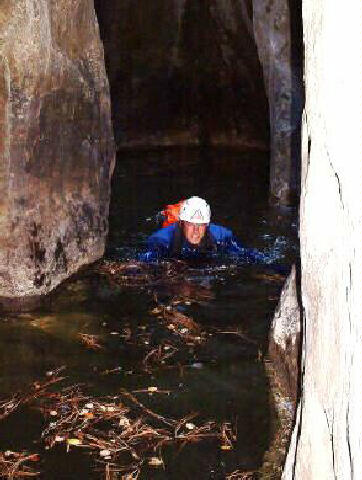 Charlie Oliver swimming through ice water